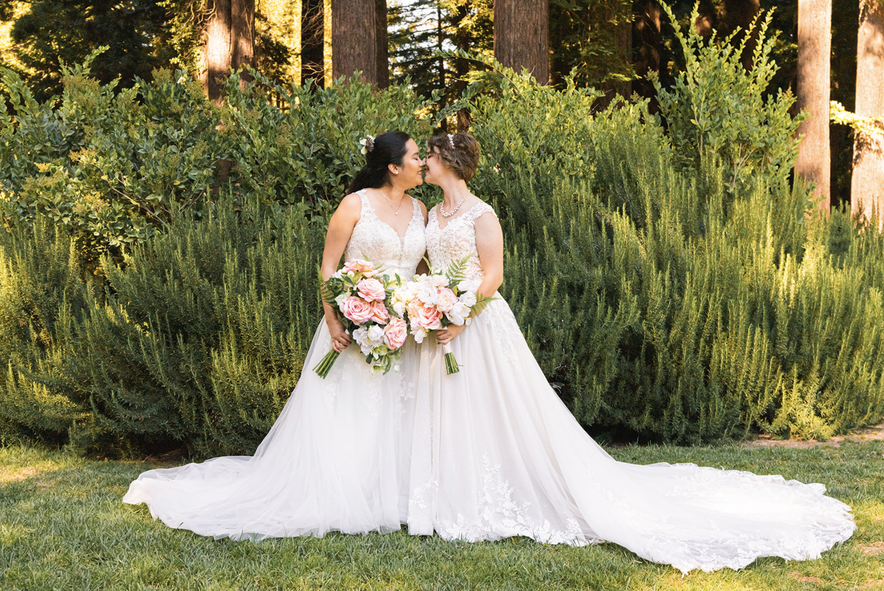 two brides lean in for a kiss at their wedding